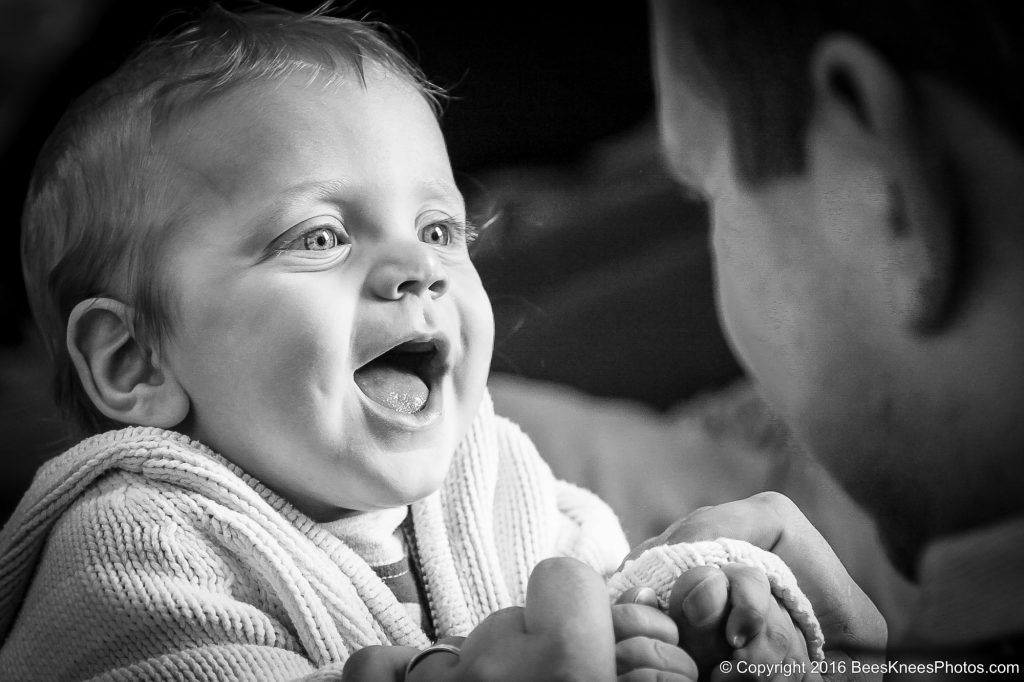 a young boy staring into his dads eyes