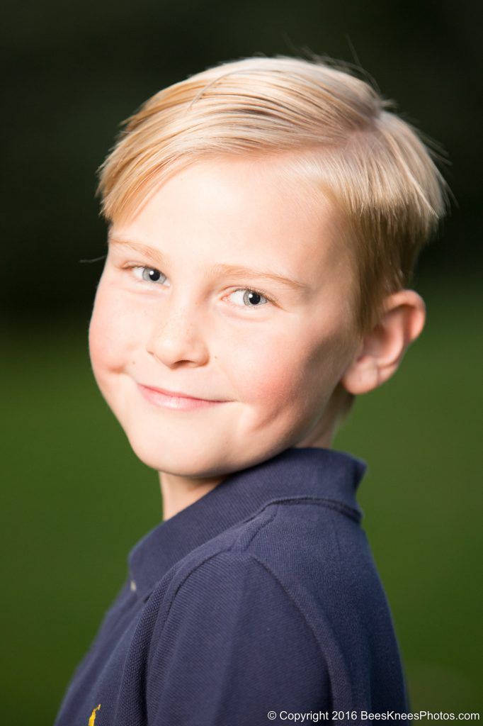 an outdoor portrait of a young boy