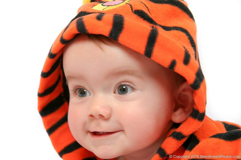 baby wearing a tigger costume