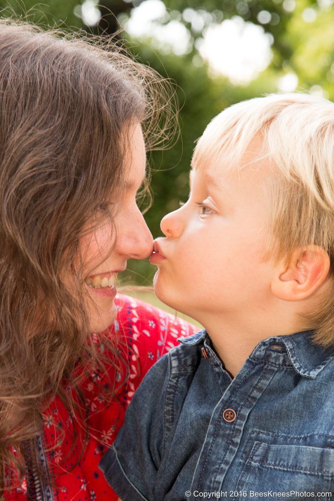 boy kissing his mum on the nose