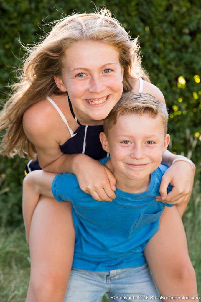 brother giving sister a piggyback