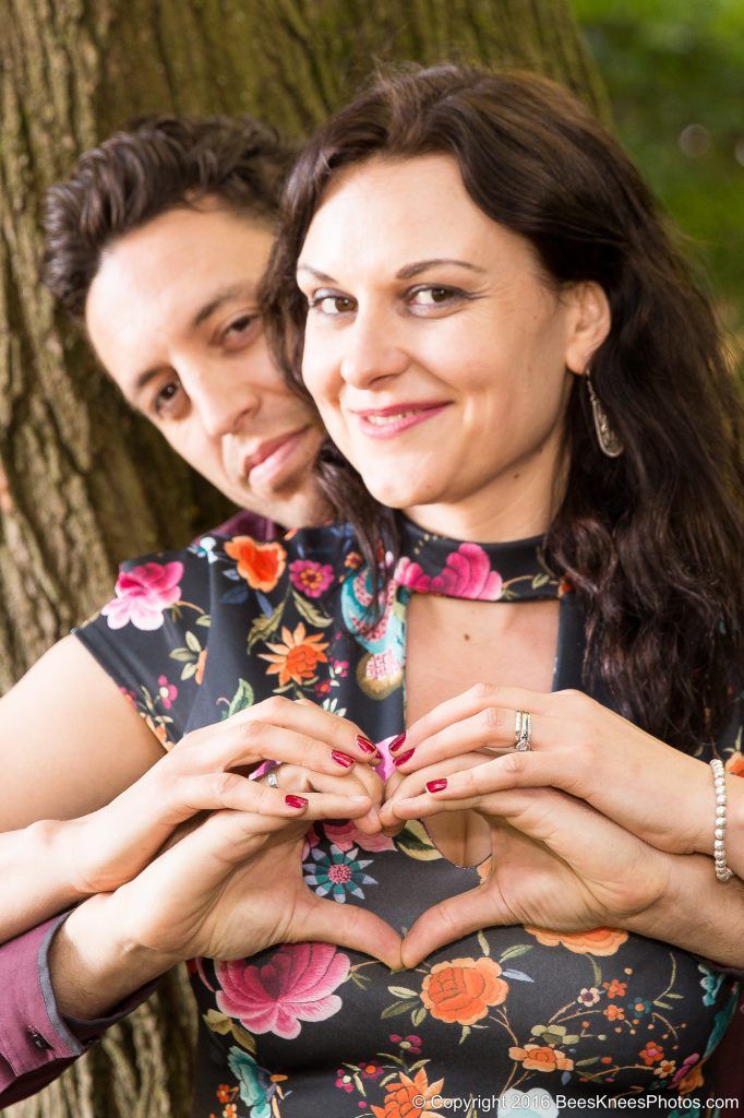 couple making hearts during a photoshoot