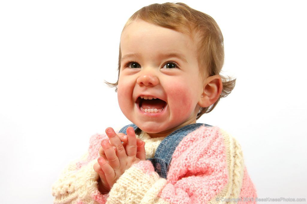 girl clapping her hands at a photoshoot