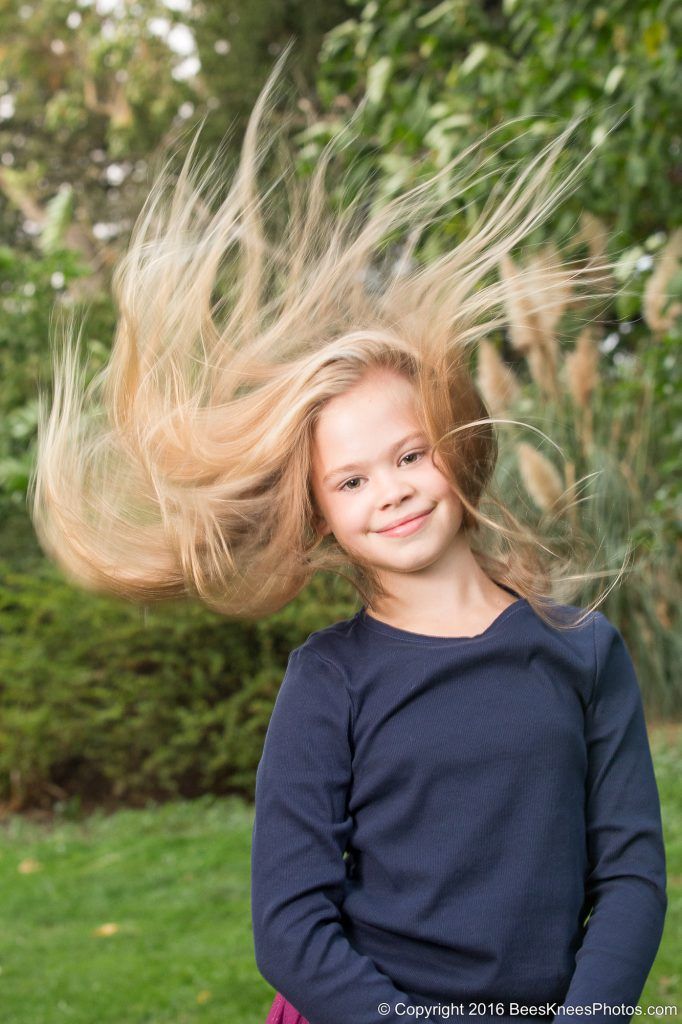 girl throwing her hair