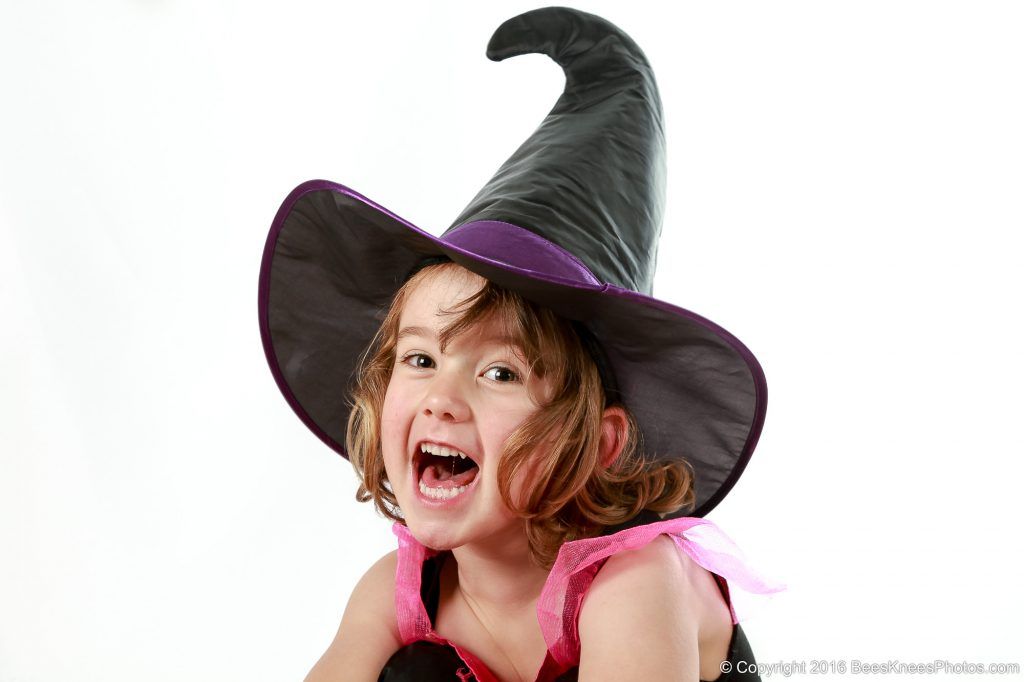 happy girl dressed up as a witch