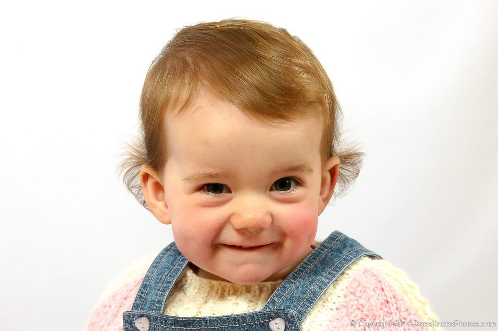 happy young girl in a studio family photoshoot