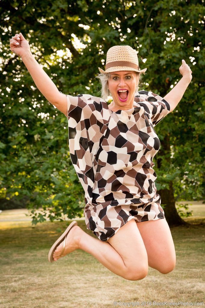 jumping woman at a photoshoot in the park