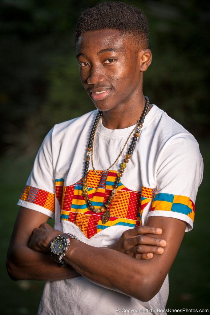 man wearing colourful necklaces