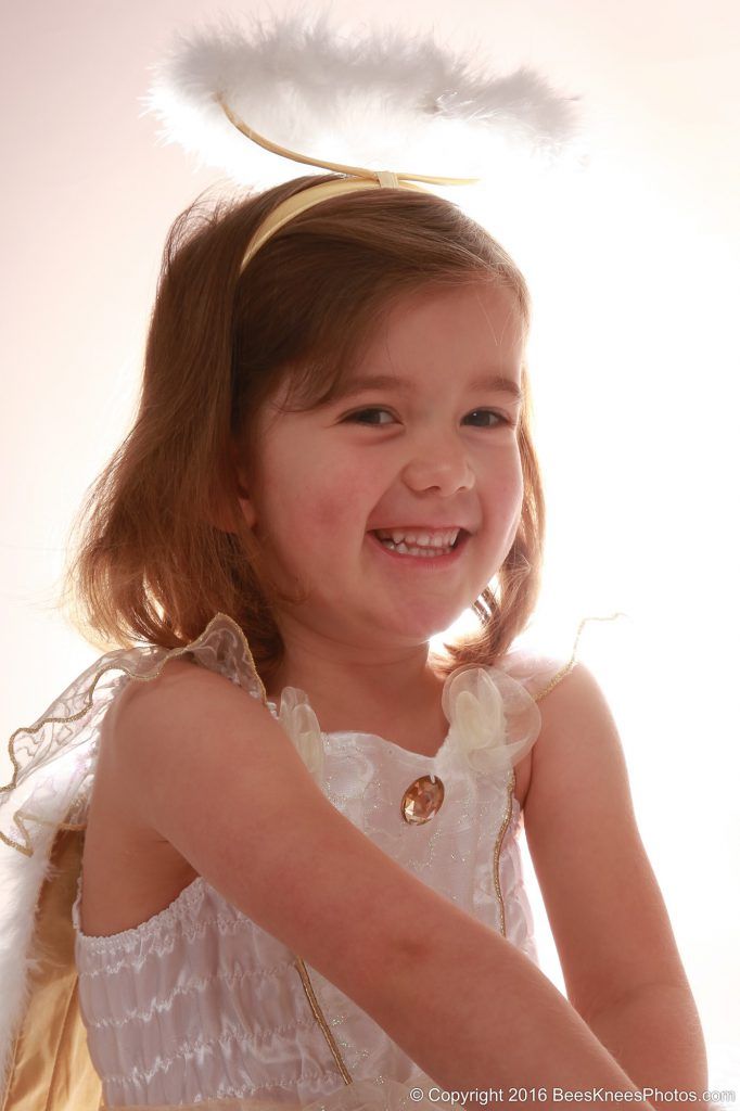 photo of a young girl dressed as an angel