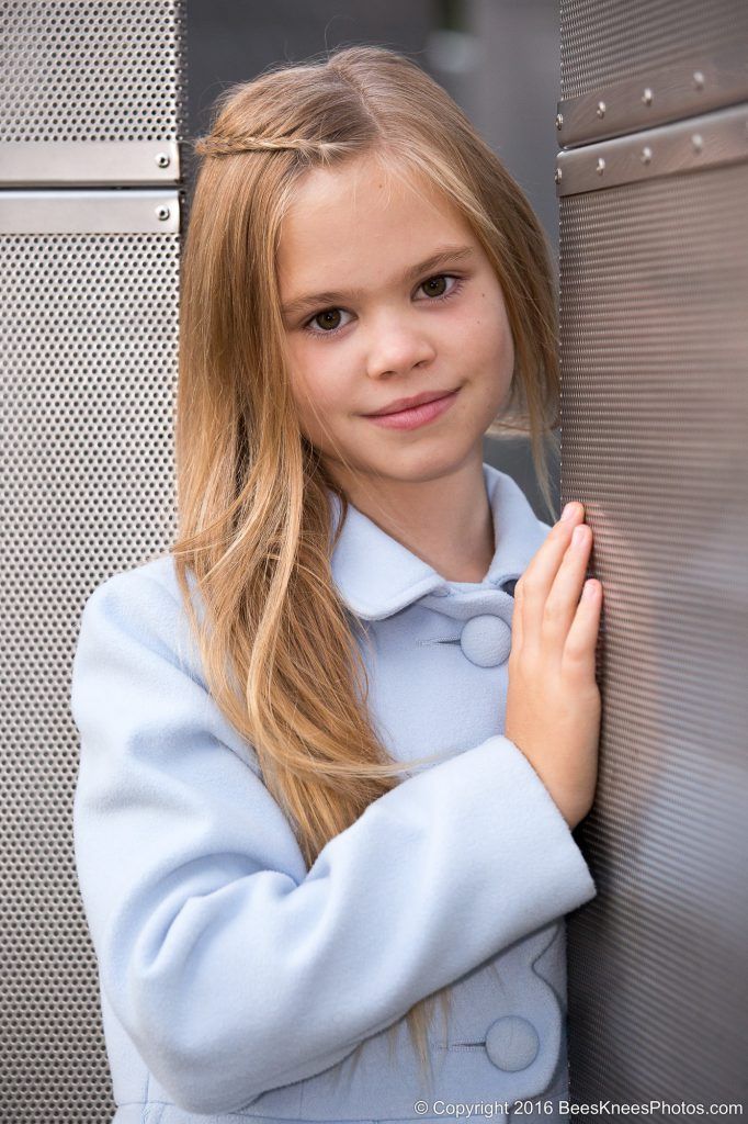 portrait of a girl in a pastel blue coat