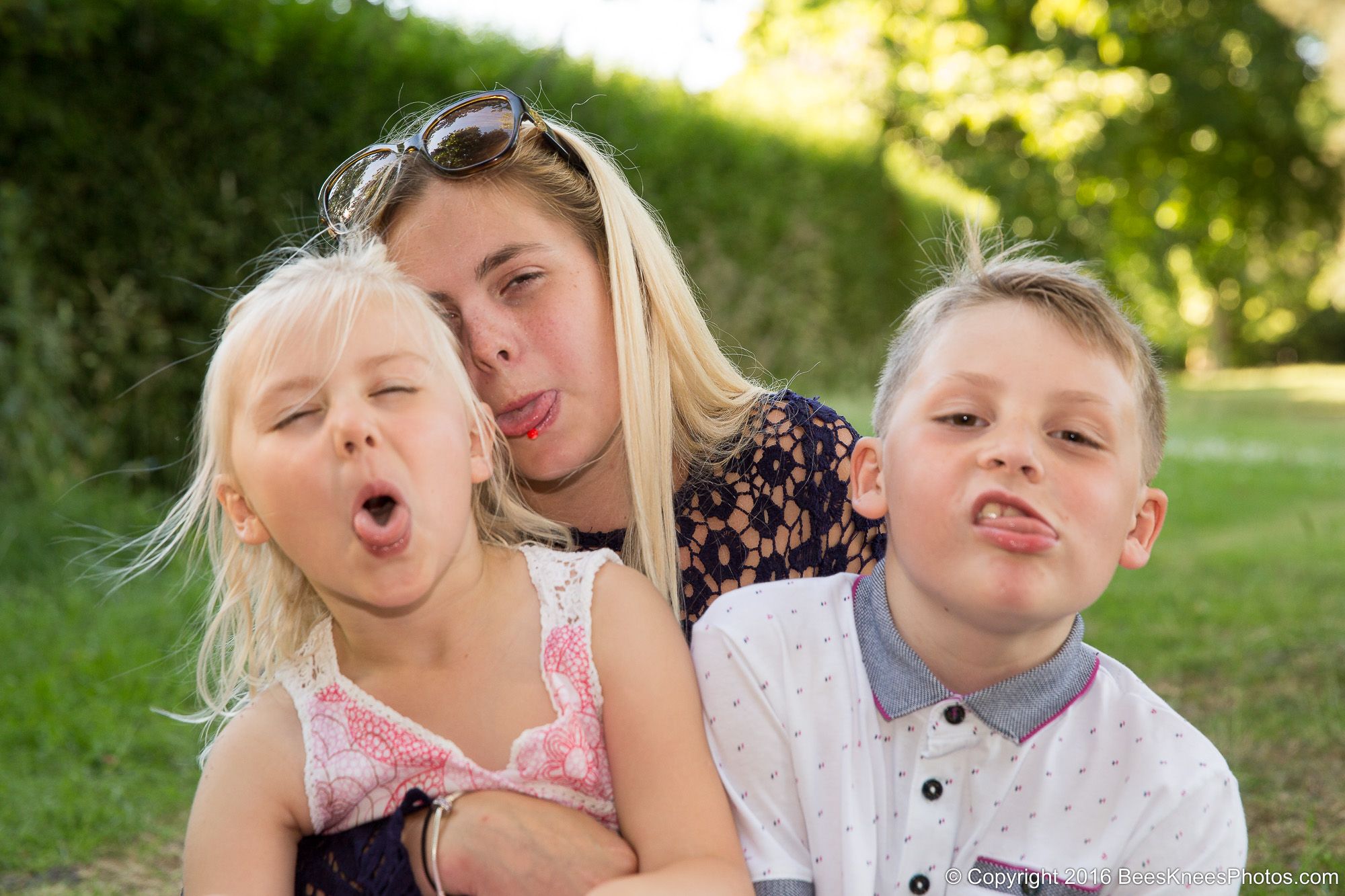 sisters and brother making funny faces