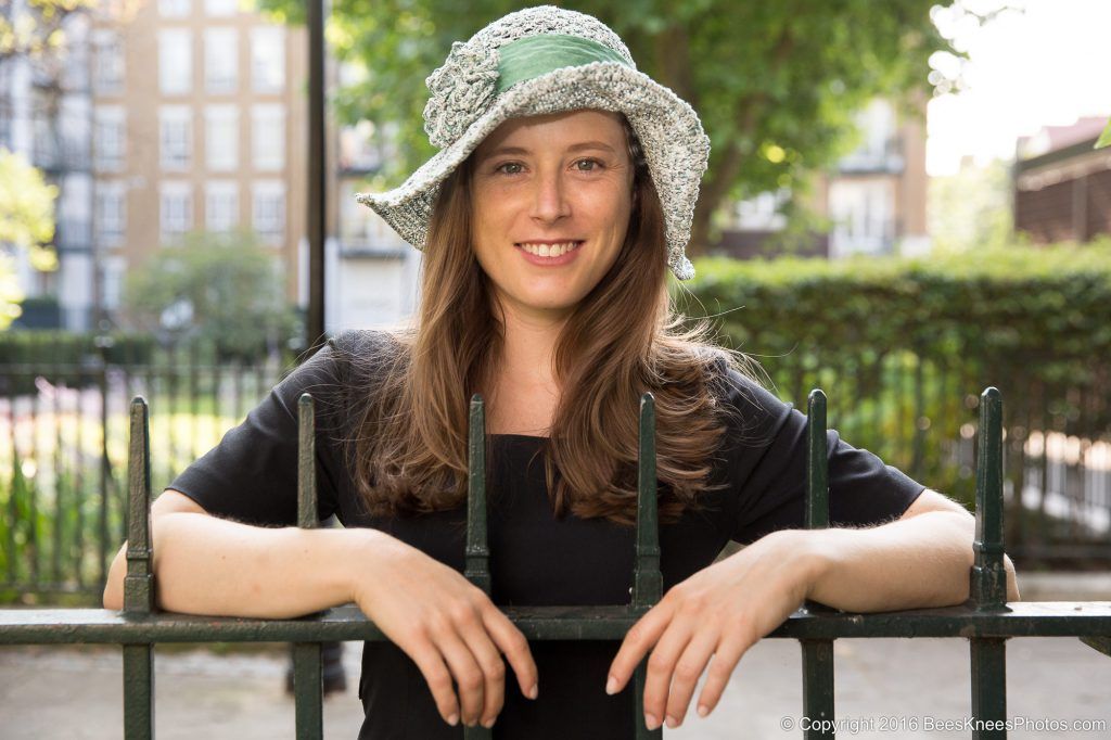 street portrait a woman in a summers hat