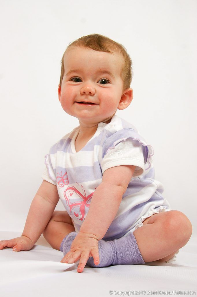 studio family photoshoot of a toddler