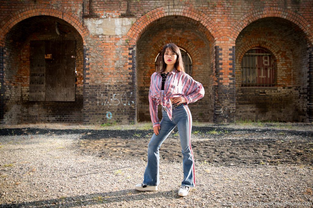 urban fashion photoshoot in front of brick railway arches