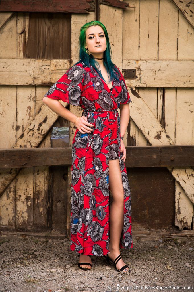 urban photoshoot of a green haired woman