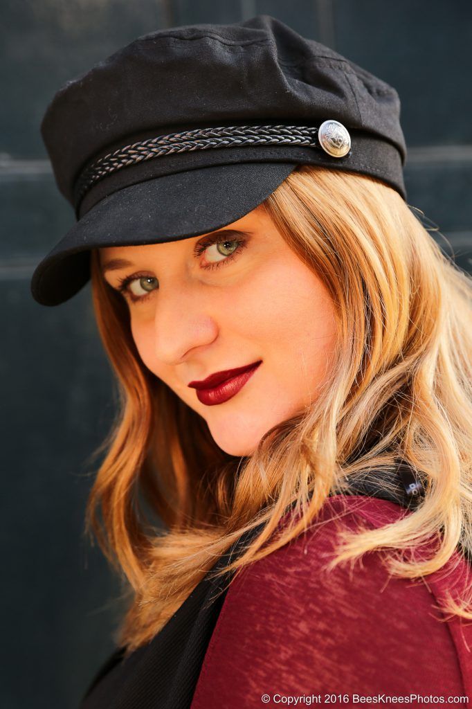 woman in a black cap