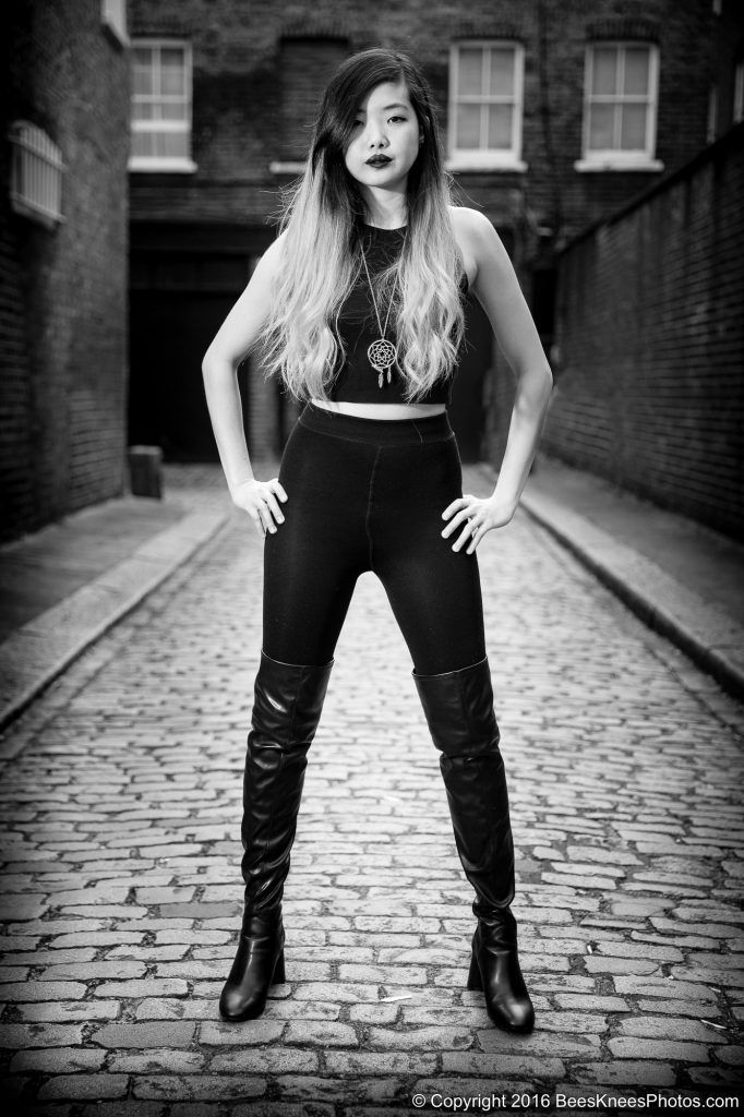 woman in black in a cobbled street