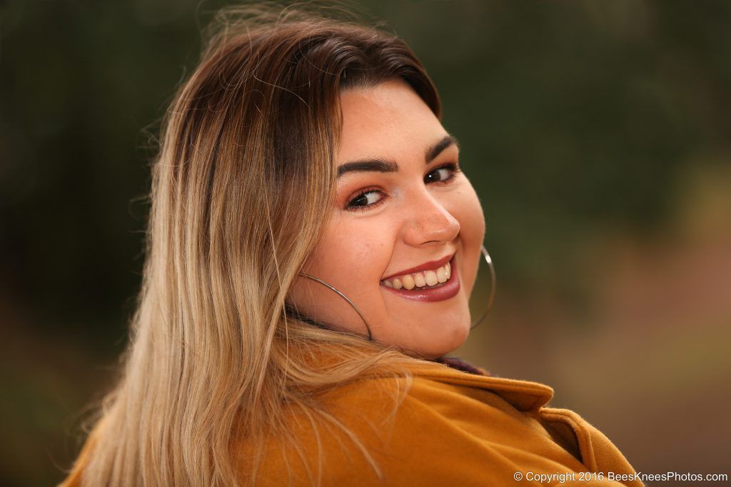 woman in the park looking over her shoulder