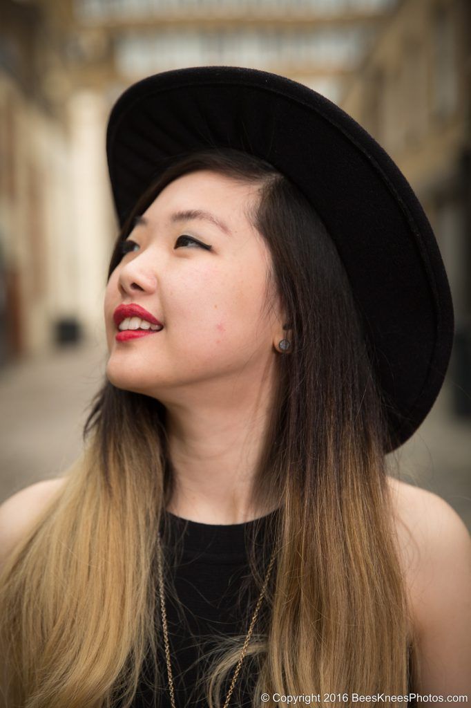 woman wearing a large stylish black hat