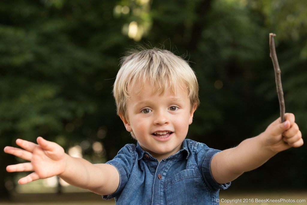 young boy doing magic