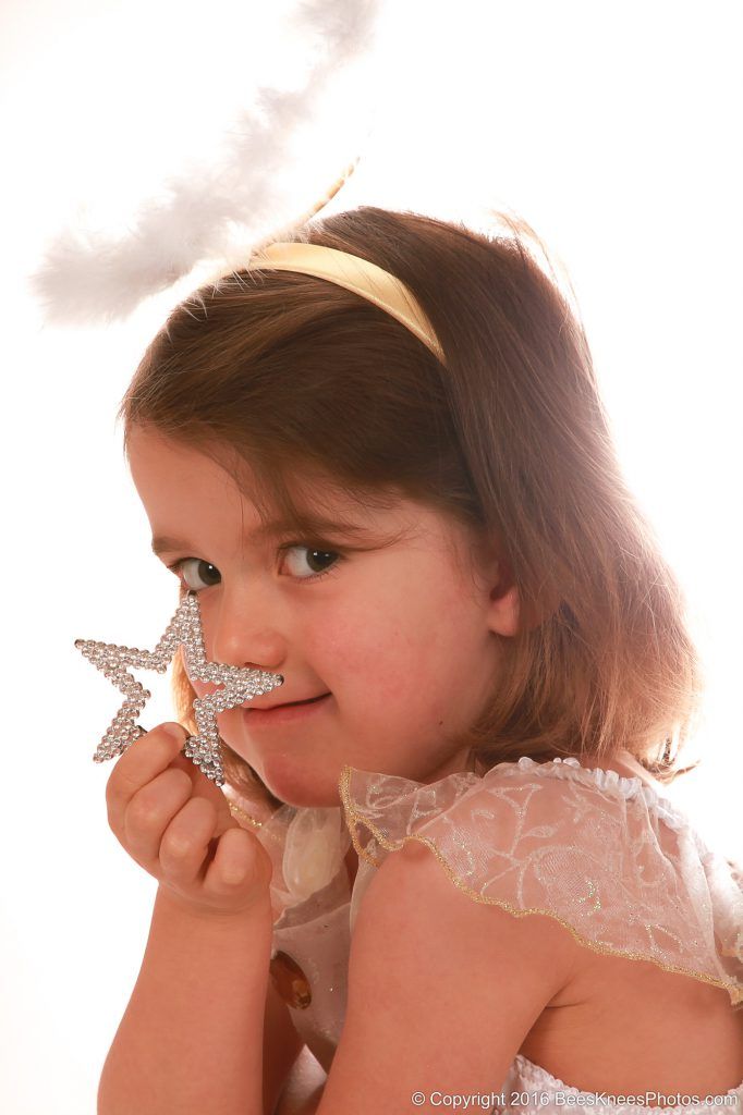 young girl holding a star