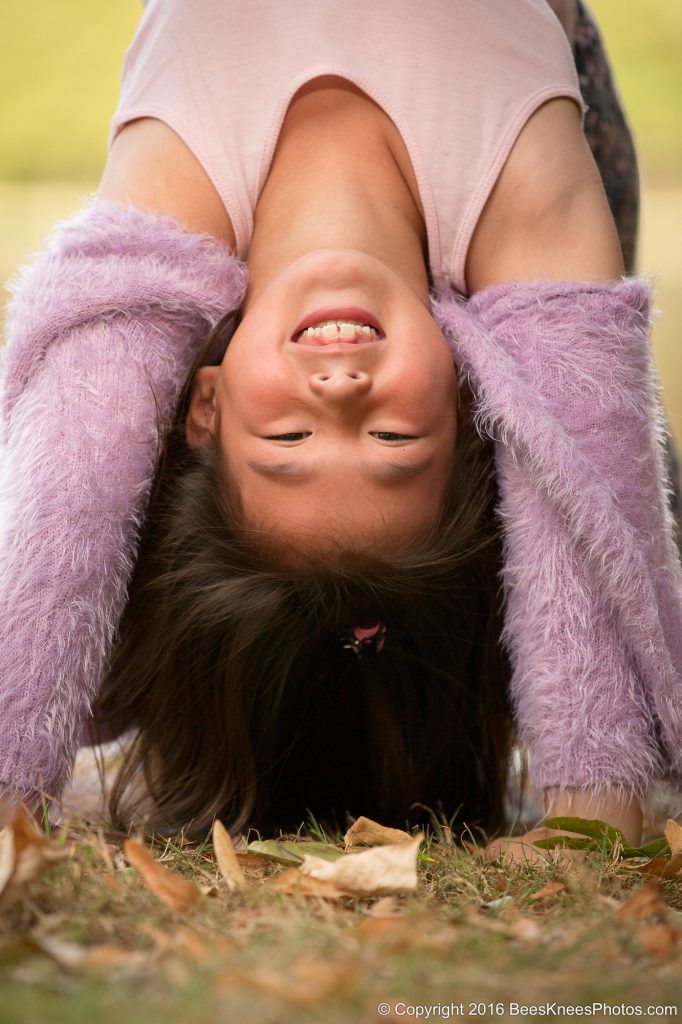 young girl upside down