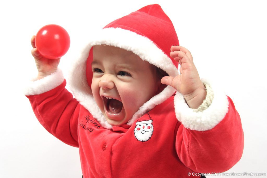 young girl wearing a santa outfit